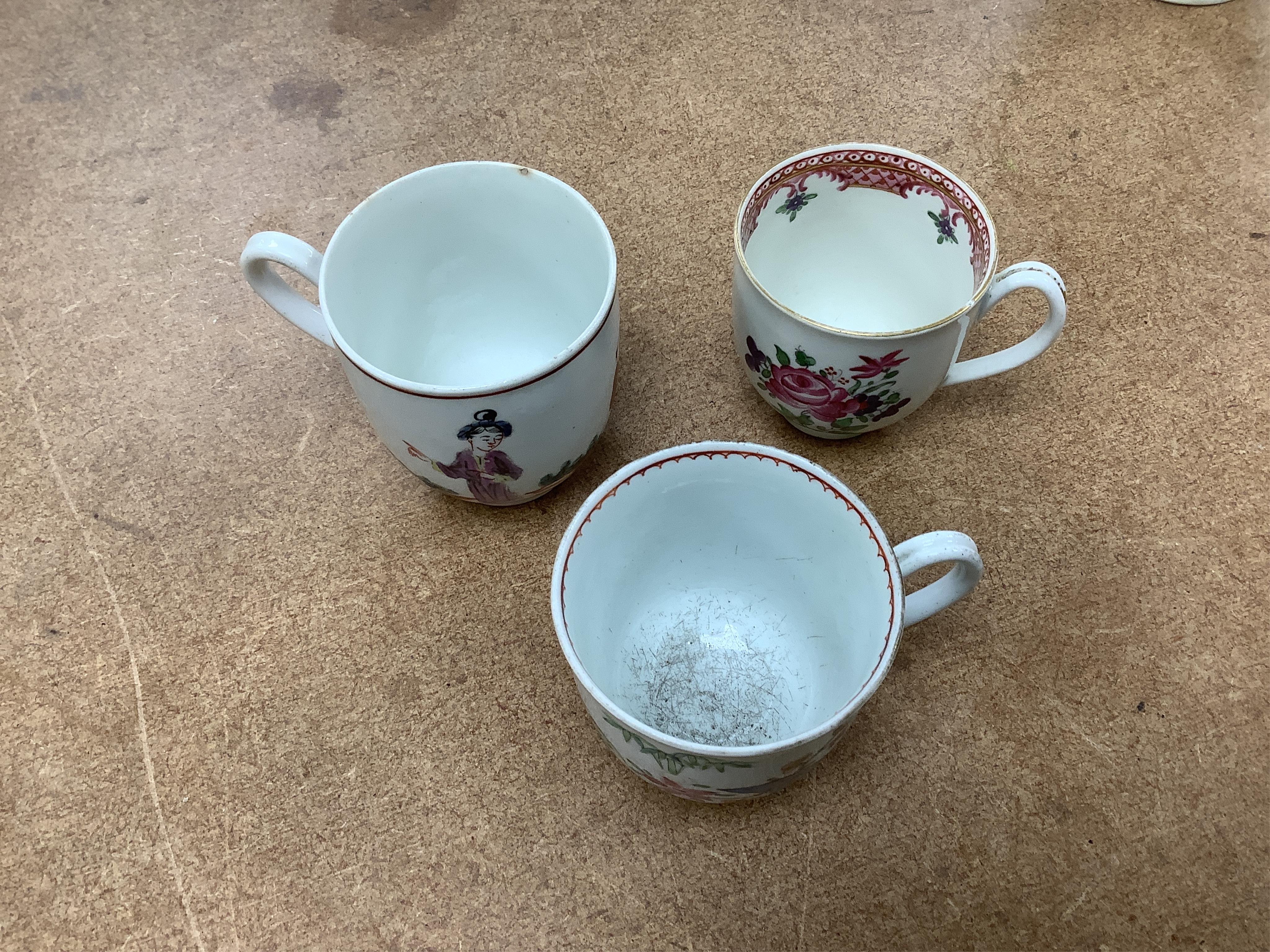 Worcester polychrome tea and coffee wares, c.1760-1780, comprising a tea caddy, a cream jug, five coffee cups and a fluted bowl, the latter with red anchor mark (8), largest tea caddy 14cm high.